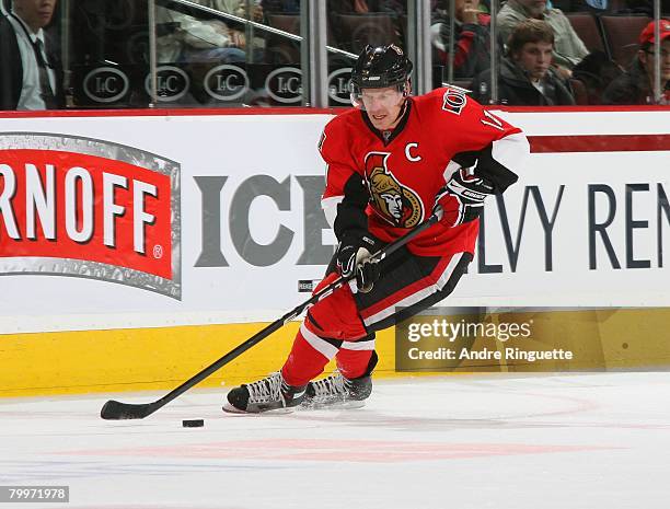 Daniel Alfredsson of the Ottawa Senators stickhandles the puck against the New Jersey Devils at Scotiabank Place on February 16, 2008 in Ottawa,...