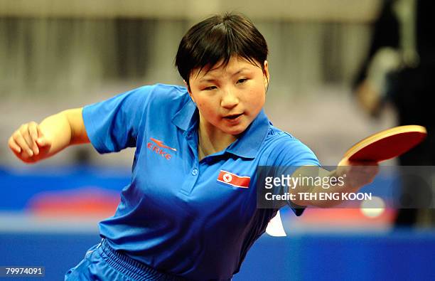 North Korea's Kim Jong returns a shot against China's Wang Nan during the women's preliminaries of the World Team Table Tennis Championship in...