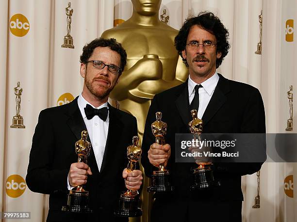 Ethan Coen and Joel Coen, winners of the Achievement In Directing award for "No Country for Old Men" pose in the press room during the 80th Annual...