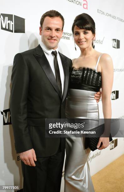 Jonny Lee Miller and Michele Hicks attend the 16th Annual Elton John AIDS Foundation Oscar Party sponsored by Chopard at the Pacific Design Center on...