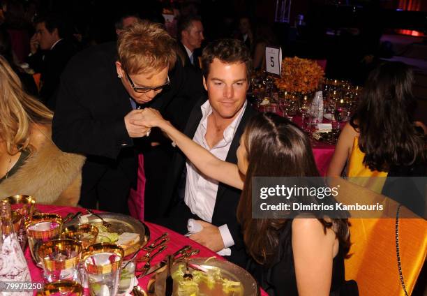 Elton John greets actor Chris O'Donnell and Caroline Fentress at the 16th Annual Elton John AIDS Foundation Academy Awards viewing party at the...