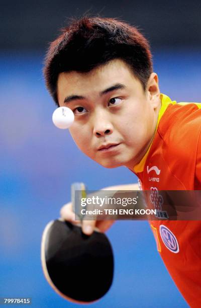 China's Wang Hao serves against Belgium's Saive Philippe during the men' s preliminaries of the World Team Table Tennis Championship in Guangzhou on...