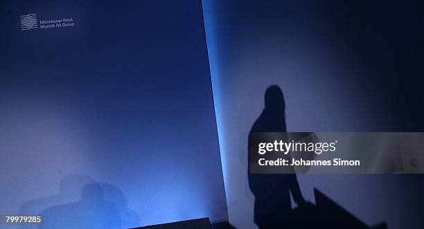 The shadow of Nikolaus von Bomhard, CEO of the Munich Re Group, is seen during the announcement of the results 2007 on February 25, 2008 in Munich,...