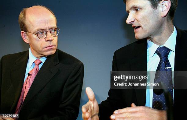 Nikolaus von Bomhard , CEO of the Munich Re Group, and CFO Joerg Schneider chat together prior to the announcement of the results 2007 on February...