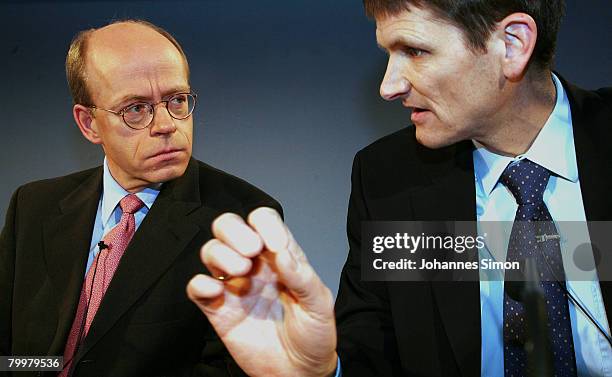 Nikolaus von Bomhard , CEO of the Munich Re Group, and CFO Joerg Schneider chat together prior to the announcement of the results 2007 on February...