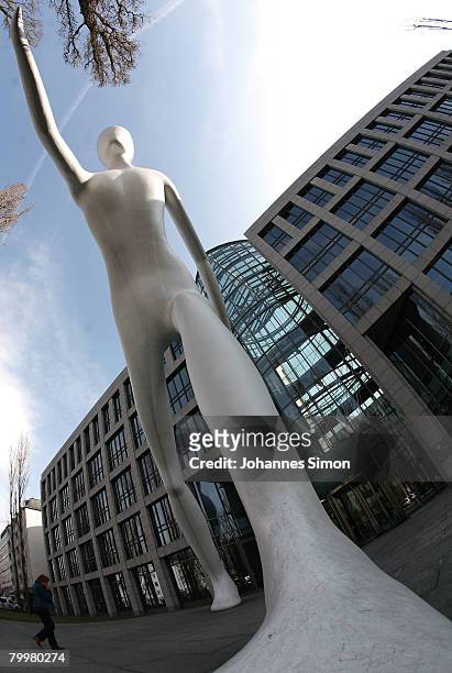 The "Walking Man" of U.S.-artist Jonathan Borofsky, is seen in front of Munich Re insurance group headquarter during the announcement of the results...