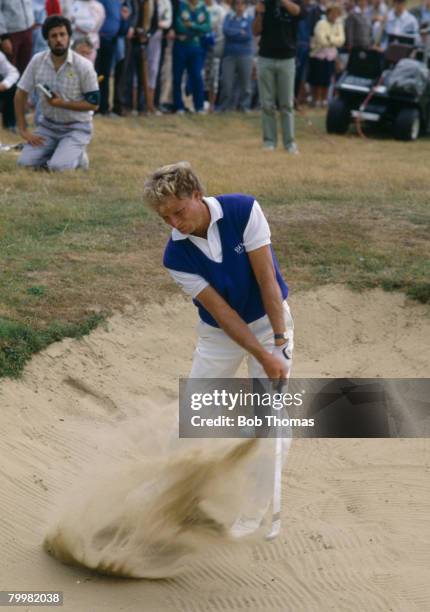 German golfer Bernhard Langer playing out of a bunker during the British Open Golf Championship held at Royal St George's, Sandwich between the 18th...