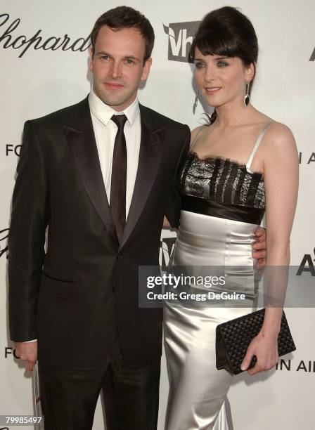 Actors Jonny Lee Miller and Michele Hicks attend the 16th Annual Elton John AIDS Foundation Oscar Party at the Pacific Design Center on February 24,...