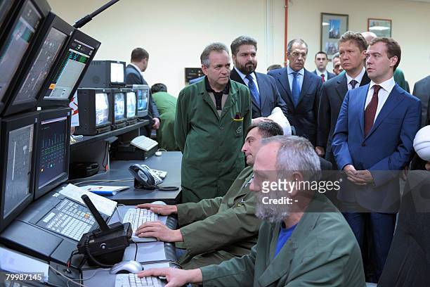 Russian deputy prime minister Dmitry Medvedev looks at control panel operators working in the command room of an oil refinery in Pancevo on February...