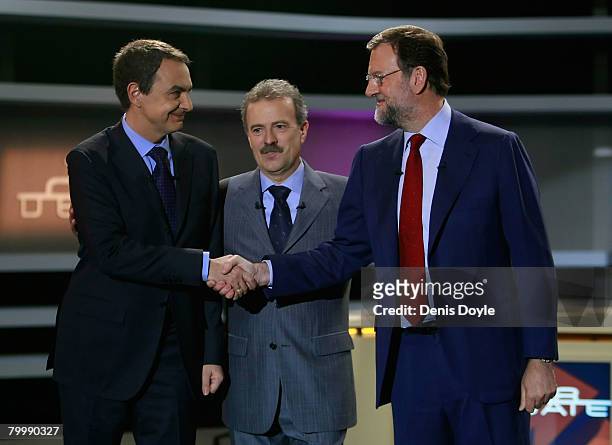 Spanish Prime Minister and Socialist party leader Jose Luis Rodriguez Zapatero shakes hands with opposition Popular Party leader Mariano Rajoy...