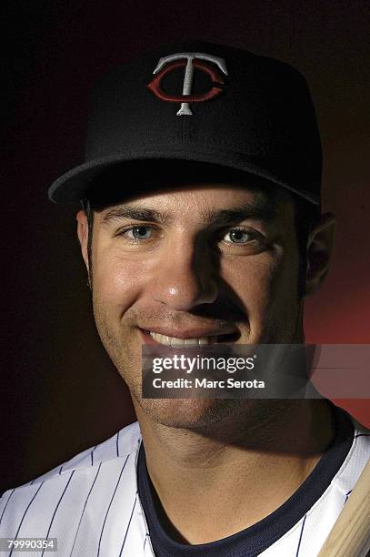 Catcher Joe Mauer of the Minnesota Twins poses for photos during spring training media day February 25, 2008 at the Lee County Sports Complex in Fort...