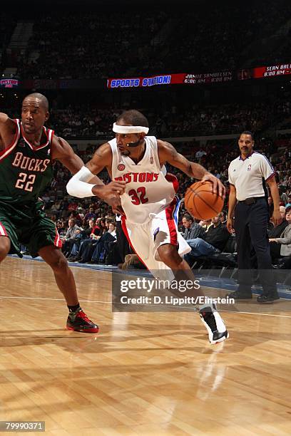 Richard Hamilton of the Detroit Pistons drives to the basket against Michael Redd of the Milwaukee Bucks during the game at the Palace of Auburn...