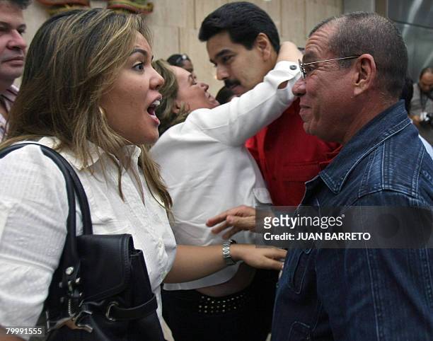 Venezuelan Minister of Interior and Justice Ramon Rodriguez Chacin talks with Carolina Perez, daughter of FARC hostage, former Colombia Congressman...