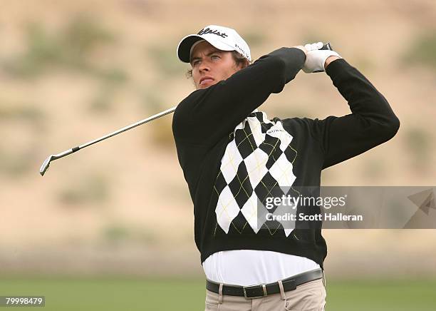 Adam Scott watches a shot during the first round matches of the WGC-Accenture Match Play Championship at The Gallery at Dove Mountain on February 20,...