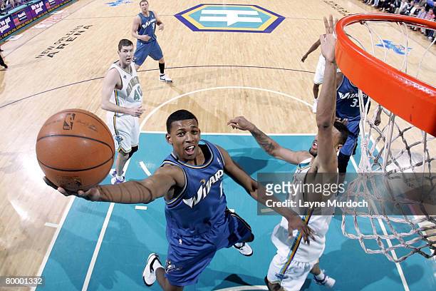 Nick Young of the Washington Wizards shoots past Tyson Chandler of the New Orleans Hornets on February 25, 2008 at the New Orleans Arena in New...
