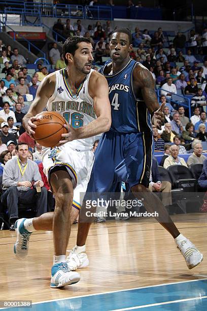 Peja Stojakovic of the New Orleans Hornets drives around Antawn Jamison of the Washington Wizards on February 25, 2008 at the New Orleans Arena in...