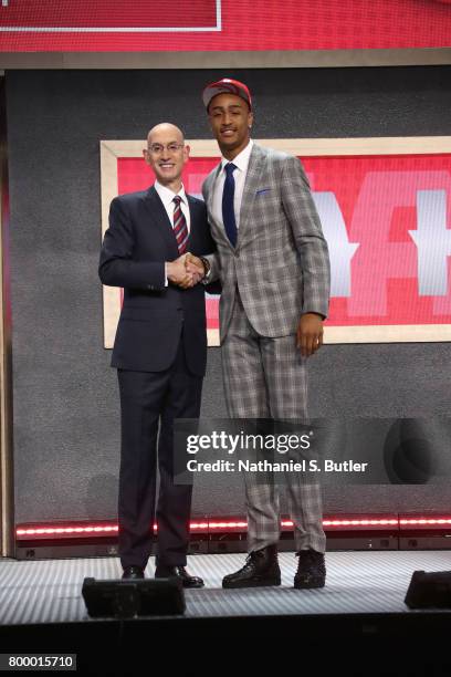 John Collins shakes hands with NBA Commissioner Adam Silver after being selected number nineteen overall by the Atlanta Hawks during the 2017 NBA...