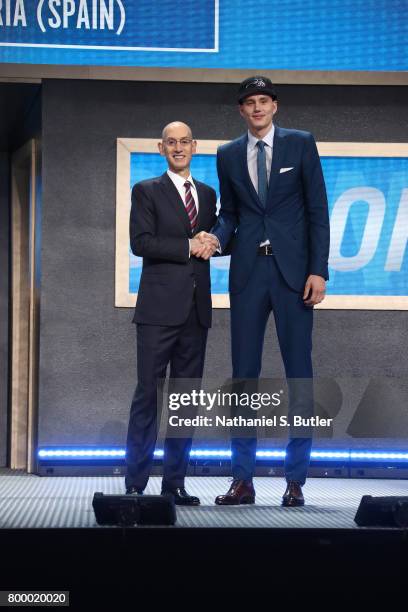 Anzejs Pasecniks shakes hands with NBA Commissioner Adam Silver after being selected twenty fifth overall by the Orlando Magic during the 2017 NBA...