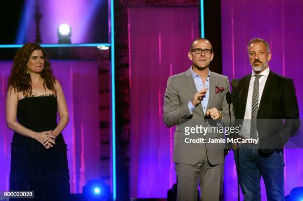 Max Mutchnick and David Kohan speak onstage with Debra Messing at the Logo's 2017 Trailblazer Honors event at Cathedral of St. John the Divine on...