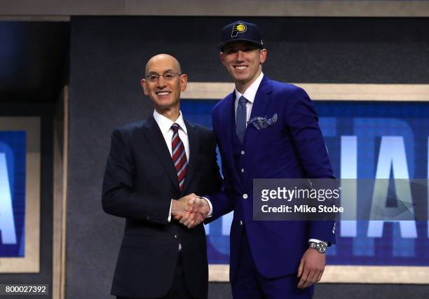 Leaf walks on stage with NBA commissioner Adam Silver after being drafted 18th overall by the Indiana Pacers during the first round of the 2017 NBA...