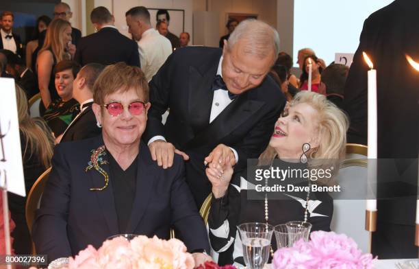 Sir Elton John, Bob Manoukian and Lynn Wyatt attend the Woodside Gallery Dinner in benefit of Elton John AIDS Foundation in partnership with BVLGARI...