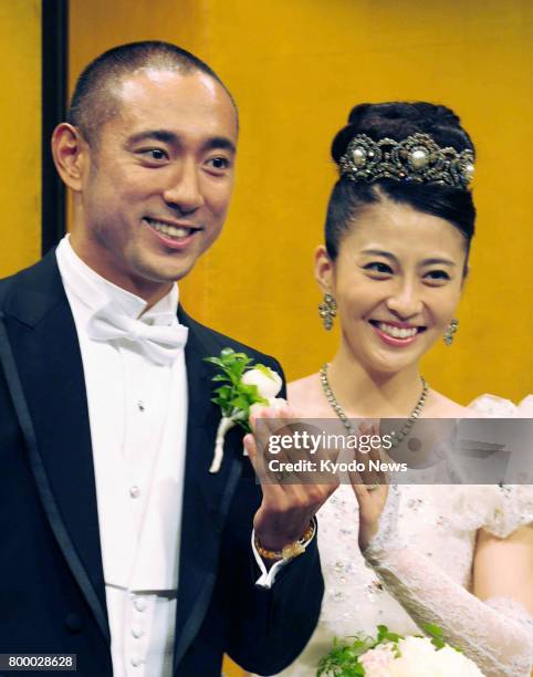 File photo taken in July 2010 shows Japanese kabuki star Ichikawa Ebizo and TV personality Mao Kobayashi during a press conference following their...