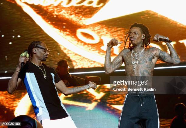 Recording artists Snoop Dogg and Wiz Khalifa perform onstage at night one of the 2017 BET Experience STAPLES Center Concert, sponsored by Hulu, at...