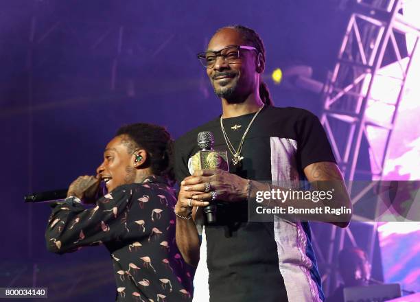 Recording artists Wiz Khalifa and Snoop Dogg perform onstage at night one of the 2017 BET Experience STAPLES Center Concert, sponsored by Hulu, at...
