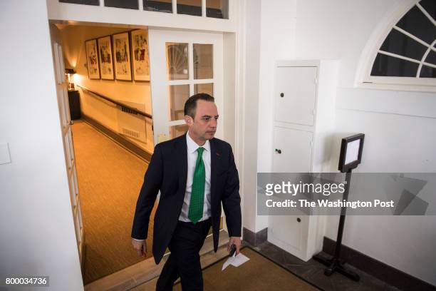 White House Chief of Staff Reince Priebus walks out before President Donald Trump speaks about the US role in the Paris climate change accord in the...
