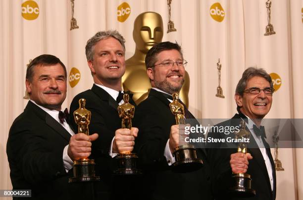 Visual effects artists Bill Westenhofer, Ben Morris, Trevor Wood and Michael L. Fink pose in the press room during the 80th Annual Academy Awards at...