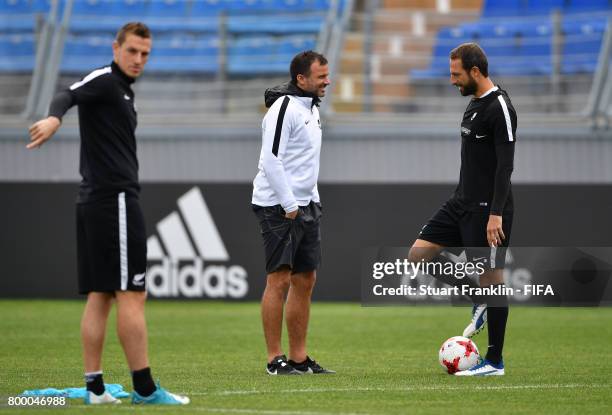 Anthony Hudson, head coach of New Zealnd talks with Andrew Durante during a training session of the New Zealand national football team on June 23,...