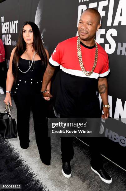 Krista Joiner and husband rapper Xzibit arrive at the premiere screening of HBO's "The Defiant Ones" at Paramount Studios on June 22, 2017 in Los...