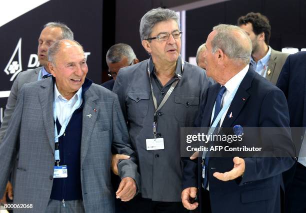 La France Insoumise leftist party's leader Jean-Luc Melenchon holds the arm of Chairperson of the Dassault Group and French senator Serge Dassault as...