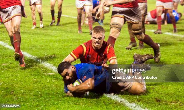 Samoa's Manu Leiataua scores a try in their rugby union Test match against Wales played in Apia on June 23, 2017. / AFP PHOTO / SAMOA OBSERVER /...