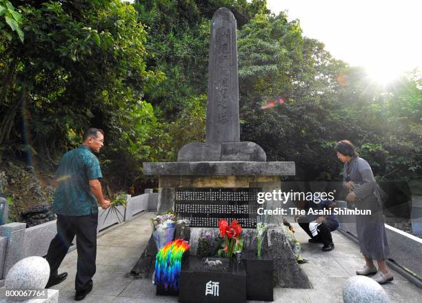 People pray for the victims on the 72nd anniversary of the end of the Battle of Okinawa at Peace Memorial Park on June 23, 2017 in Itoman, Okinawa,...