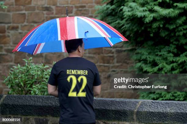 Mourner wearing a "Remember 22" shirt attends the funeral service of Manchester attack victim Alison Howe at St Anne's Church on June 23, 2017 in...