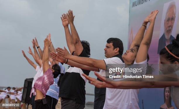 Maharashtra Chief Minister Devendra Fadnavis with Police and Bandra residence performing Yoga on the International Yoga Day at Bandra Reclamatiom,...