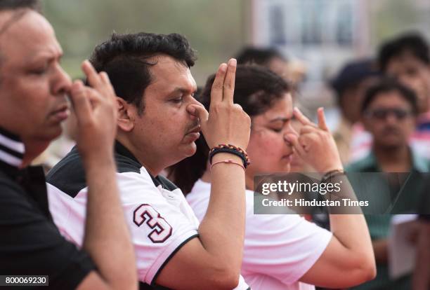 Maharashtra Chief Minister Devendra Fadnavis with Police and Bandra residence performing Yoga on the International Yoga Day at Bandra Reclamatiom,...