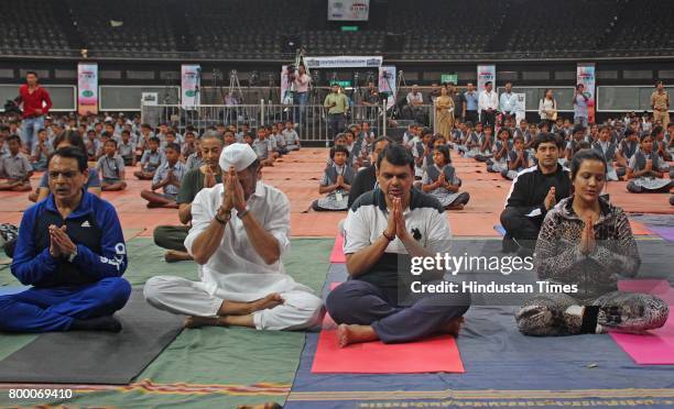 Chief Minister of Maharashtra Devendra Fadnavis with his wife Amruta Fadnavis and Bollywood actor Jackie Shroff and with children of farmers those...