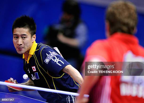 Japan's Yoshida Kaii returns a shot against Russia's Mazunov Dmitry during the World Team Table Tennis Championship in Guangzhou, China's Guangdong...