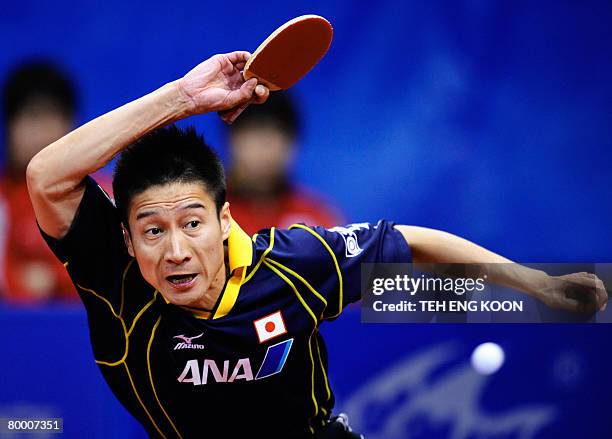 Japan's Yoshida Kaii returns a shot against Russia's Mazunov Dmitry during the World Team Table Tennis Championship in Guangzhou, China's Guangdong...