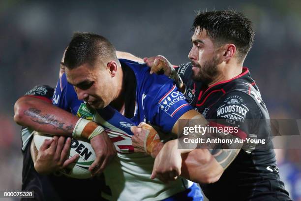 Michael Lichaa of the Bulldogs is tackled by Shaun Johnson of the Warriors during the round 16 NRL match between the New Zealand Warriors and the...