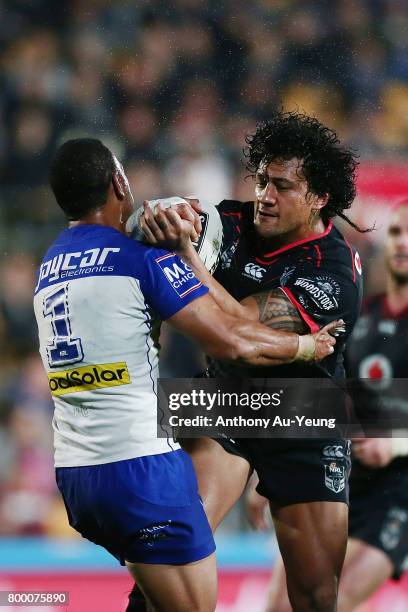 James Gavet of the Warriors clashes with Aiden Tolman of the Bulldogs during the round 16 NRL match between the New Zealand Warriors and the...