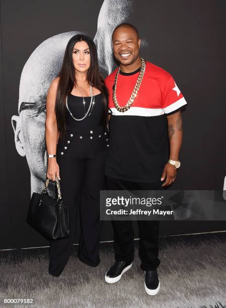 Rapper Xzibit and wife Krista Joiner attend the premiere of HBO's 'The Defiant Ones' at Paramount Theatre on June 22, 2017 in Hollywood, California.