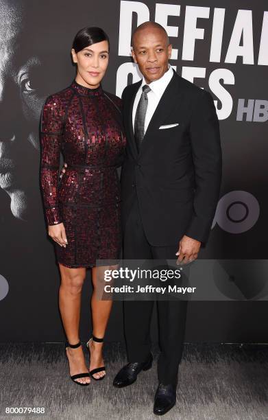 Music producer Dr. Dre and wife Nicole Young attend the premiere of HBO's 'The Defiant Ones' at Paramount Theatre on June 22, 2017 in Hollywood,...