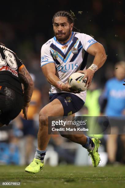 Konrad Hurrell of the Titans runs the ball during the round 16 NRL match between the Wests Tigers and the Gold Coast Titans at Campbelltown Sports...
