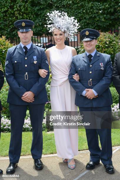 Charlotte Hawkins poses with members of the armed forces on day 4 of Royal Ascot at Ascot Racecourse on June 23, 2017 in Ascot, England.