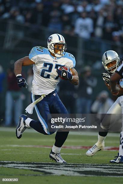 Tennessee Titans running back Eddie George heads upfield during the Titans 41-24 loss to the Oakland Raiders in the 2002 AFC Championship on .