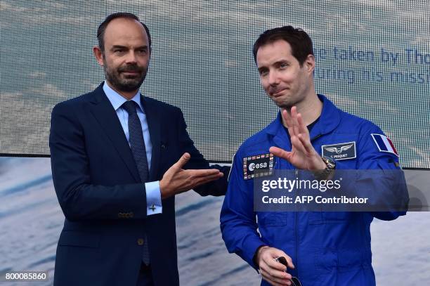 French Prime Minister Edouard Philippe stands with French astronaut Thomas Pesquet during a visit to the International Paris Air Show in Le Bourget...