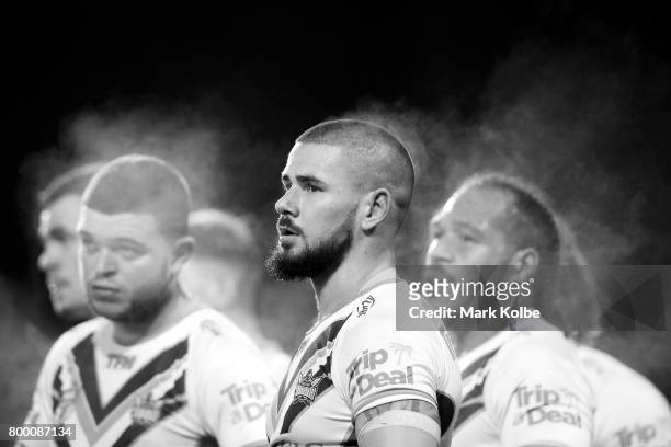 Steam rises from Nathan Peats of the Titans as he watches on after a Tigers try during the round 16 NRL match between the Wests Tigers and the Gold...